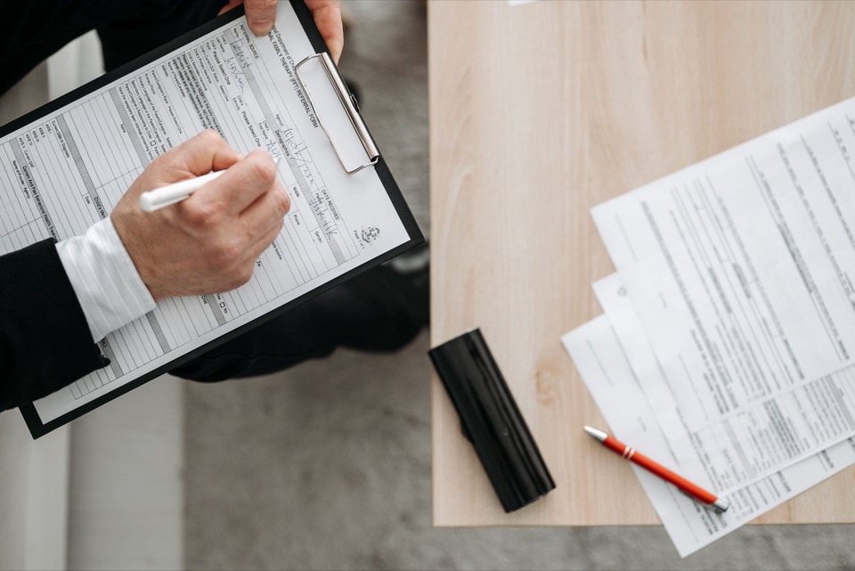 Marked-up document review on a desk